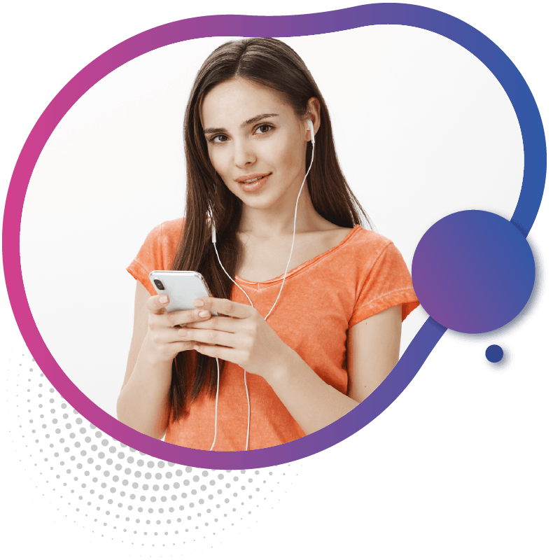 A women wearing headphones and an orange shirt holds a smartphone, appearing focused on their device, symbolizing the environmentally friendly advantages of using eSIM technology in Australia
